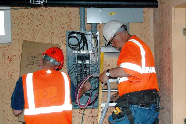 Electrician testing a consumer unit and wiring