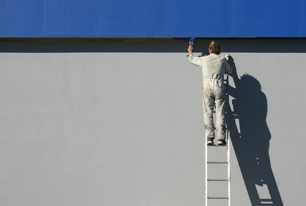 Tradesperson handing over a written price quote