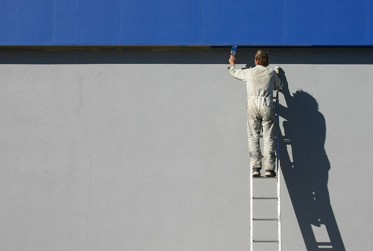 Tradesperson handing over a written price quote