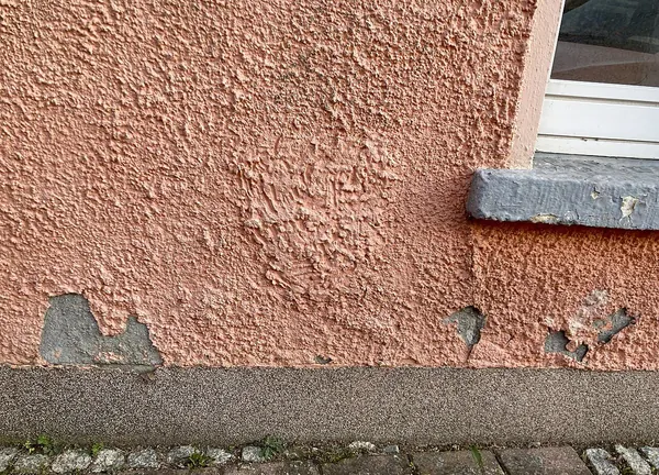 Damp patch and mould on a wall