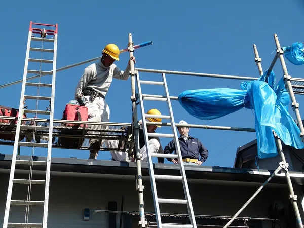 solar panels being installed on a roof