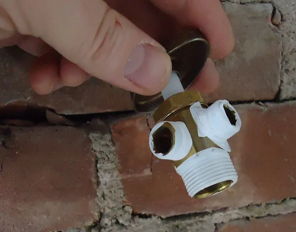 tradesperson repairing work inside a home
