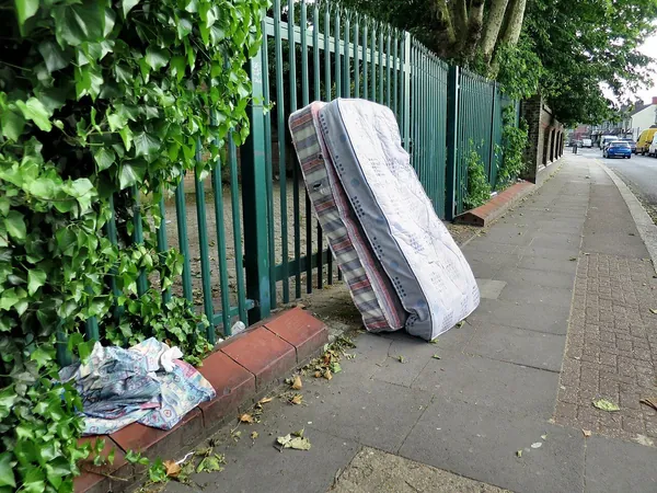 Old sofa and furniture set out for collection
